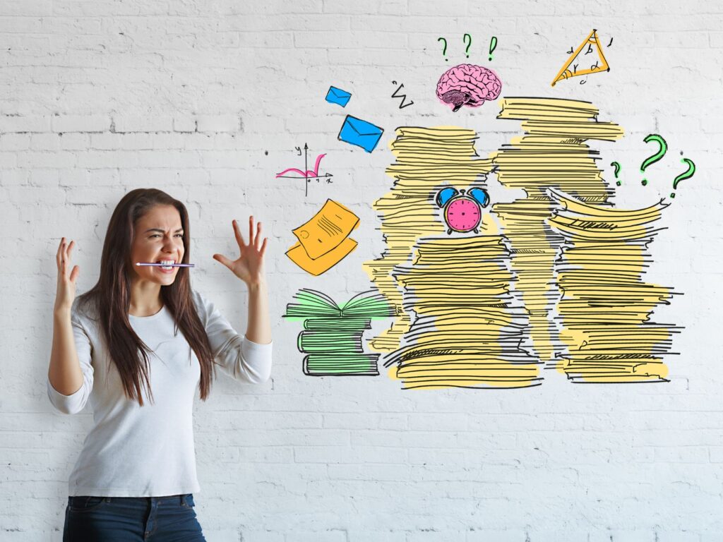 A woman gesturing in front of a white wall with colorful illustrations of stacks of paper, a brain, a clock, books, mathematical symbols, and question marks, symbolizing overload or stress related to tasks or studying.